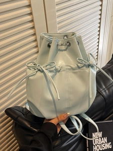 Modern light blue PU leather bucket backpack with drawstring and decorative bows