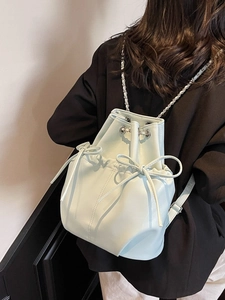 Chic mint blue bow drawstring bucket backpack in polished faux leather for women