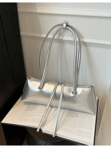 Silver glossy leather baguette shoulder bag with dual zipper and minimalist long straps