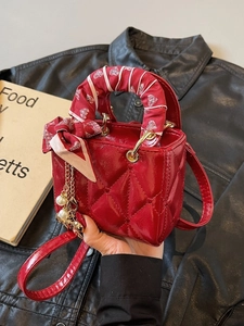 Mini red quilted patent leather handbag with silk scarf handle and pearl pendant