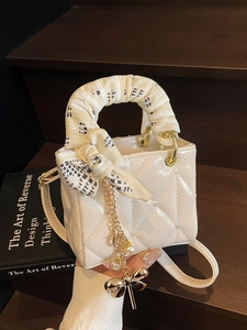 Elegant cream quilted patent leather mini handbag with silk scarf and pearl chain