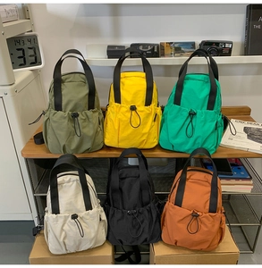 Detailed view of lightweight nylon backpack collection in six vibrant outdoor colors