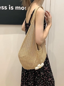 Large woven hollow tote bag with daisy detail for summer beach and commute use