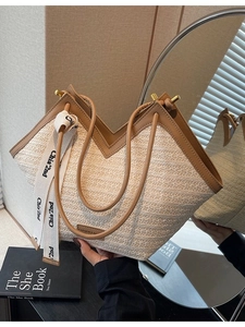 Large capacity straw woven tote bag with V-shaped opening and brown leather handles
