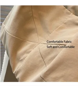 Close-up of beige ripstop fabric with grid texture and reinforced stitching on tote bag