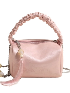 Pink pleated pillow shoulder bag with metal chain and decorative tassel details
