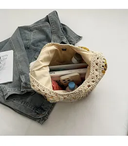Interior view of woven straw tote bag with sunflower decor and magnetic closure
