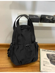 Lightweight black nylon multi-purpose outdoor backpack and handbag for travel and commute