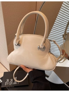 Chic cream patent leather shell handbag with silver hardware and detachable strap