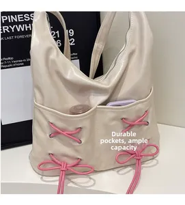 Detail of durable front pockets and spacious interior of the ballet style tote bag