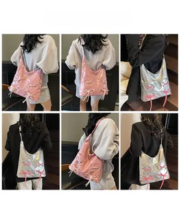 Detailed views of pink and silver glossy tote bags with bow ribbon detailing