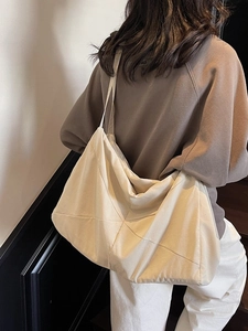 Quilted off-white oversized tote bag with geometric stitching for women's daily commute
