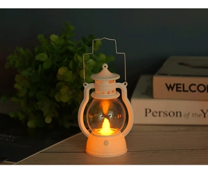 Detail of white vintage LED lantern with metal handle for Halloween ambient decoration