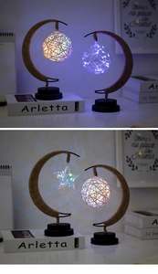 Detail of crescent moon night light with LED star globes and woven rattan ball pendants