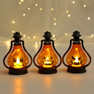 Three Halloween pumpkin LED lanterns with spooky faces for festive party decorations