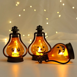 Halloween pumpkin LED lanterns with spooky faces on vintage frames and warm bokeh background