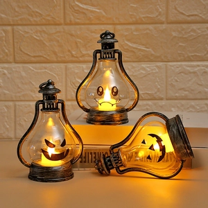 Three retro Halloween pumpkin lanterns with warm LED light and silver distressed finish