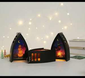 Set of three gothic black Halloween lanterns with spooky hand-drawn pumpkin and witch motifs