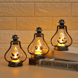 Retro Halloween LED lanterns with ghost faces and silver finish on vintage display books