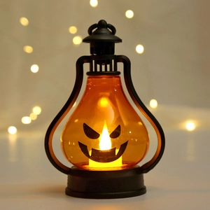 Portable LED Halloween pumpkin lantern with smiling face and warm yellow light