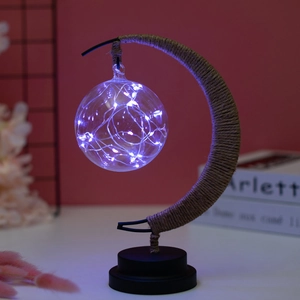 Artistic moon shaped LED desk lamp with purple glass ball and hemp rope wrap detail