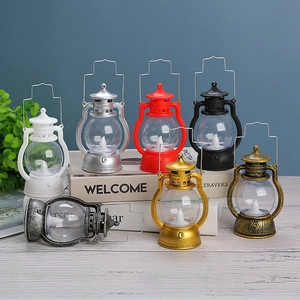 Retro LED Halloween lanterns in seven colors on decorative books for party atmosphere
