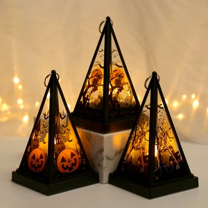Three Halloween lantern pyramid lights with pumpkin witch and skull patterns