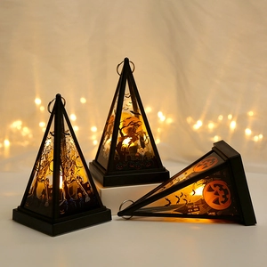 Three LED Halloween lanterns with warm yellow light showing witch and skull illustrations
