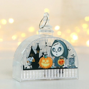 Detail of LED Halloween lantern with Reaper and pumpkin graphics on ribbed plastic