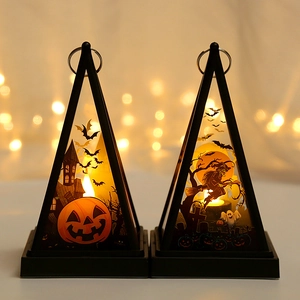 Detail of Halloween LED lanterns showing pumpkin and witch designs with warm glow