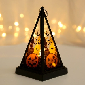 Halloween pumpkin lantern with warm LED light featuring bats and spooky castle details