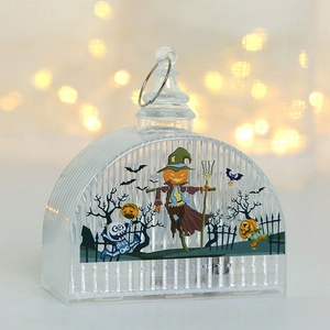 Detail of Halloween lantern decoration featuring a scarecrow and skeleton with warm bokeh