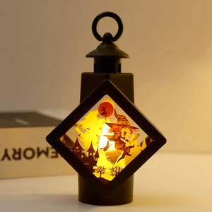 Retro Halloween lantern with wizard and castle silhouette and warm LED light decoration