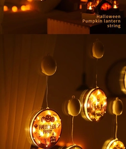 Detail of warm white LED Halloween lights featuring pumpkin and castle illustrations