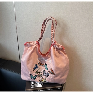 Sac fourre-tout en toile rose avec broderie papillon et poignées géométriques