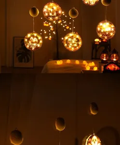 Detail showing hanging Halloween LED lights with pumpkin, owl, and ghost silhouettes
