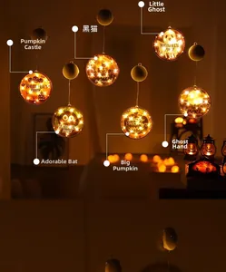 Detailed view of six Halloween hanging lanterns with warm glowing pumpkin and ghost patterns