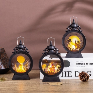 Retro Halloween LED lanterns with witch and castle silhouettes in warm orange glow