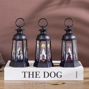 Three-piece retro Halloween lanterns with witch and pumpkin patterns on white decorative books