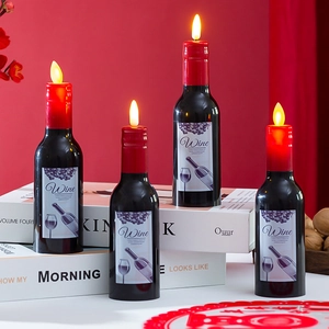 Set of four wine bottle shaped LED candles with realistic flickering flames for decor