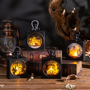 Set of four Halloween lanterns with pumpkin and witch patterns on a vintage table