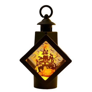 Vintage black Halloween lantern with spooky castle silhouettes and warm LED light
