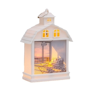 White house-shaped LED night light with warm sunset balcony scene and metal handle