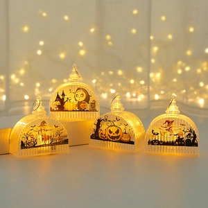 Set of four Halloween LED pumpkin lanterns with silhouette designs and warm glow