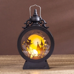 Detail of Halloween round lantern featuring witch silhouette and warm LED candle light