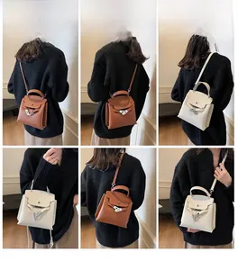 Detailansicht brauner und cremefarbener Handtaschen aus Leder mit Litschimaserung und Tragearten