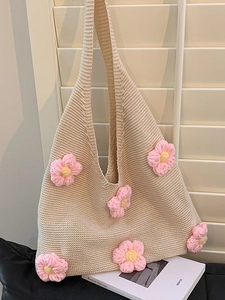 Knitted floral tote bag with 3D pink flowers on cream crochet texture for summer styling