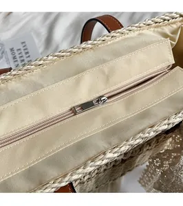 Detailed close-up showing smooth zipper closure and woven texture of the beach tote bag