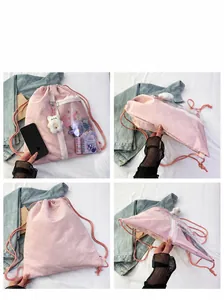 Pink canvas backpack with a clear window display and white zipper details