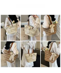 Detail of woven straw tote bag with elegant lace bow and leather shoulder straps